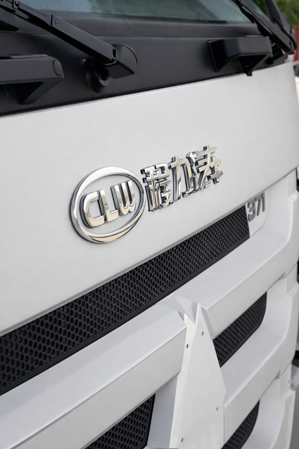 Close-up quality detail of aircraft refueling truck front badge and grille